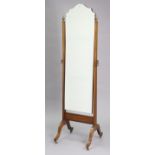 A mahogany rectangular cheval mirror inset with a bevelled plate, & on square tapered supports &