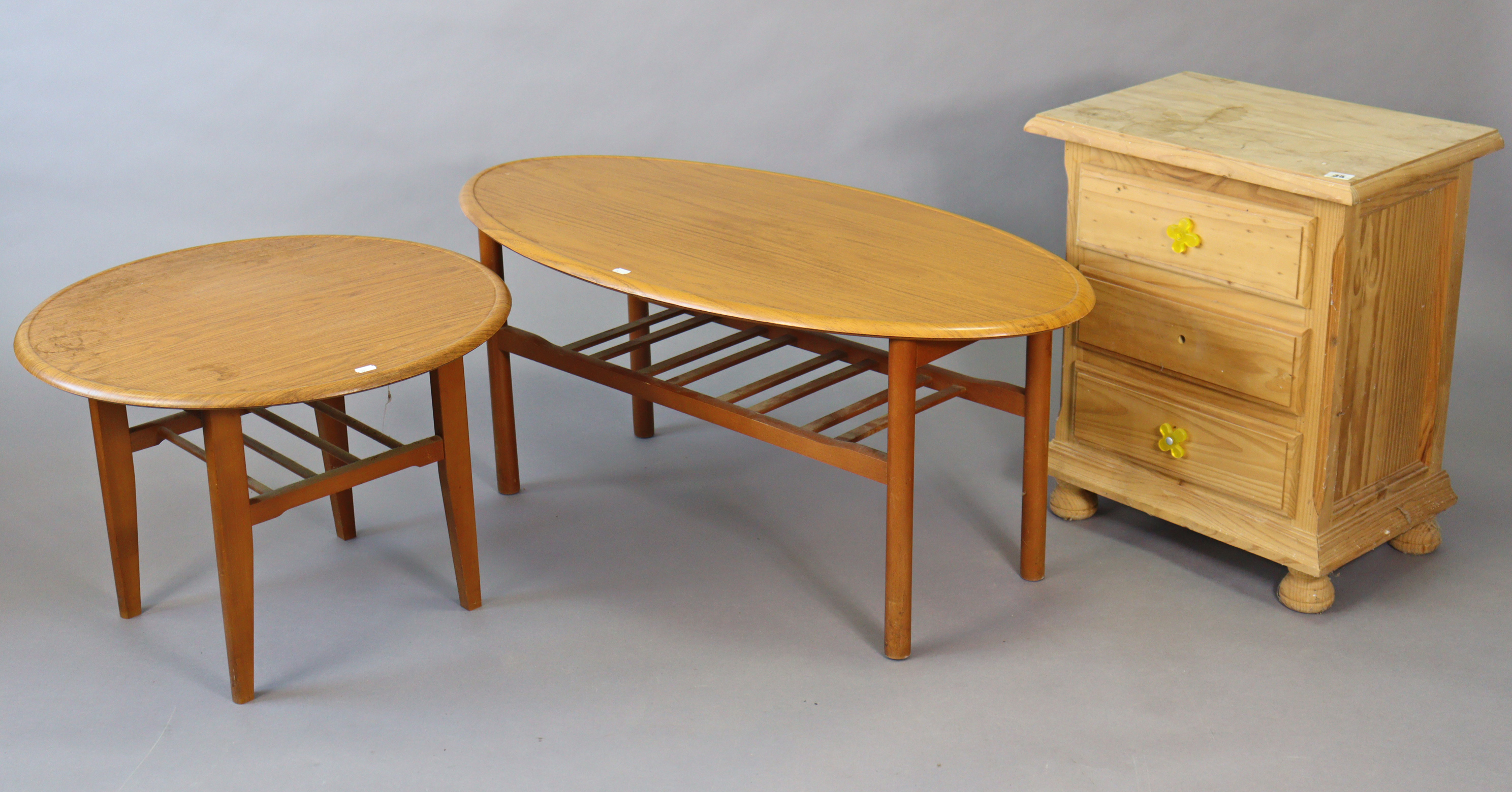 A pine three-drawer bedside chest, 20” wide x 24” high; & two formwood coffee tables.