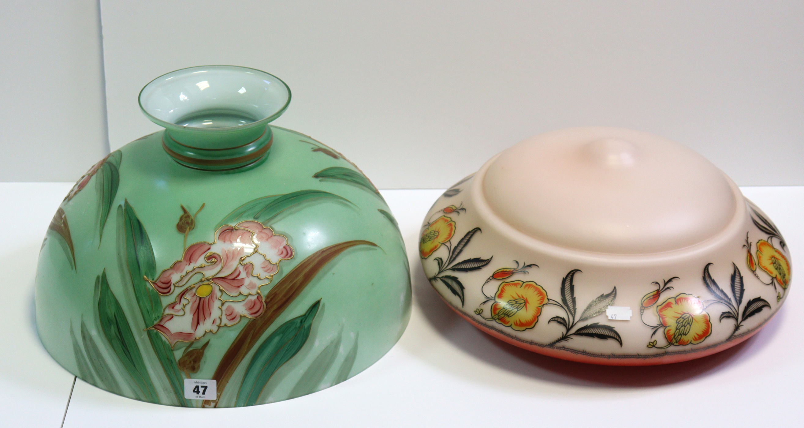 Three vintage coloured-glass ceiling light shades; & a similar oil lamp shade.