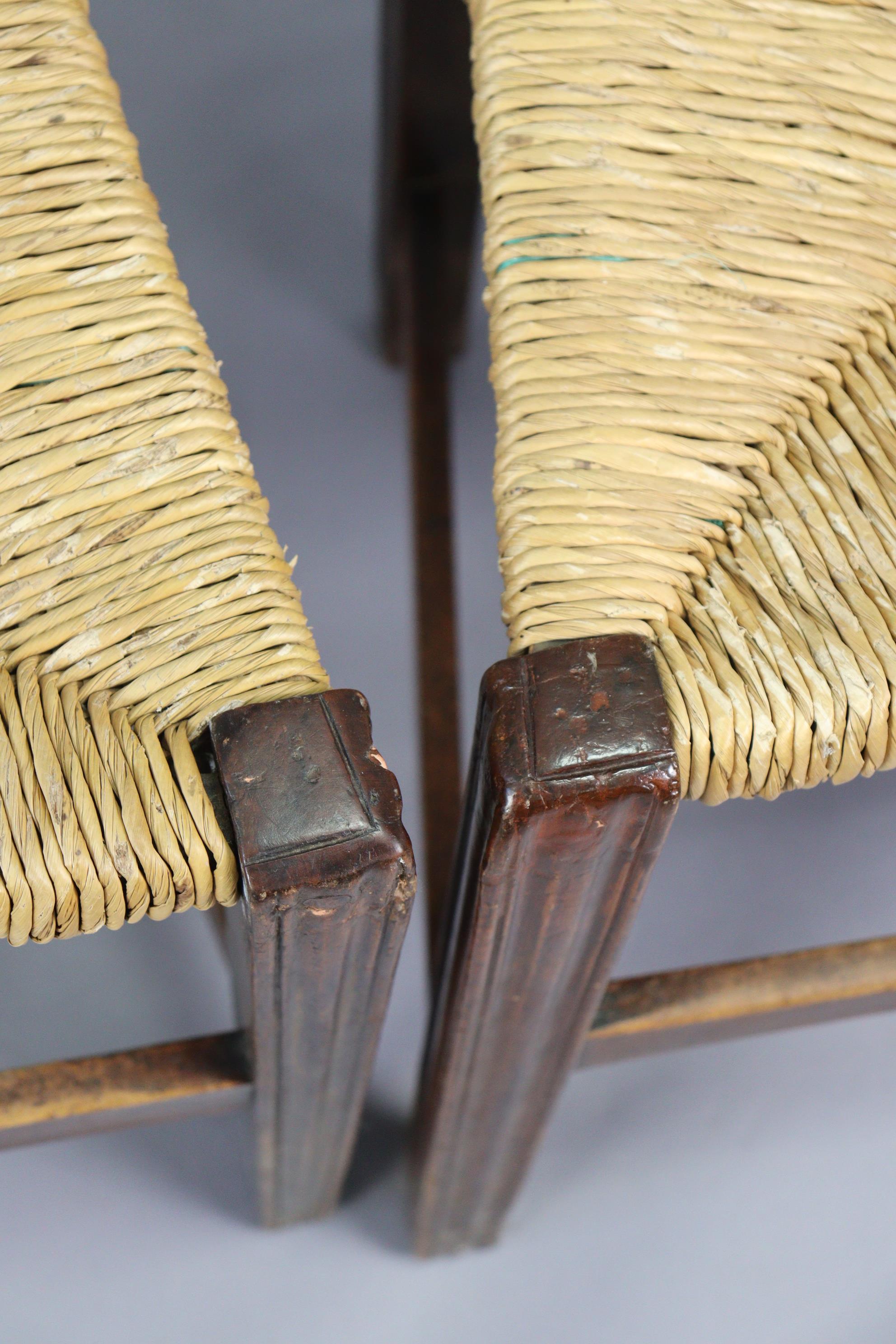 A set of three early 20th century splat-back dining chairs each with a woven-rush seat, & on - Image 5 of 10