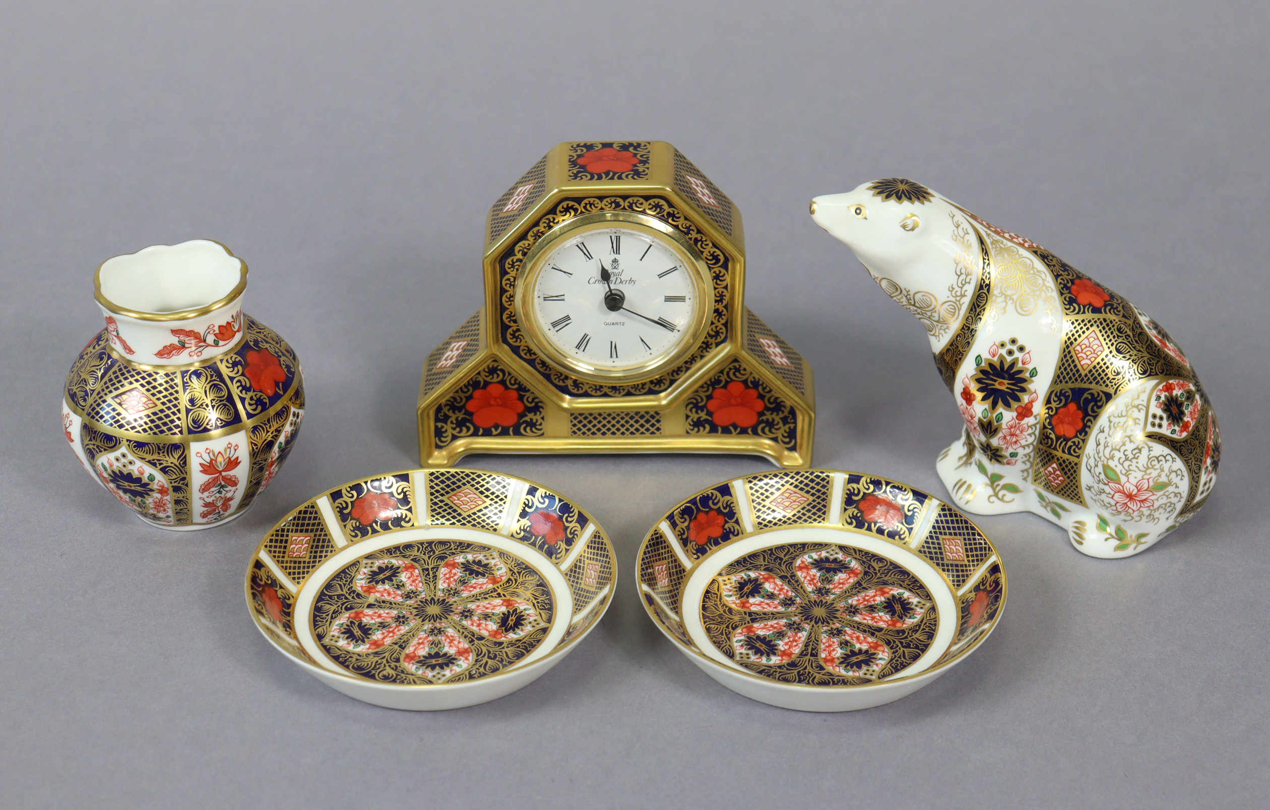 A Royal Crown Derby “Polar bear” paperweight; a ditto “Old Imari” timepiece, 4¼” high; a ditto vase;