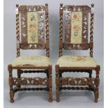 A pair of antique carved oak side chairs each with a padded seat & back, & on barley-twist &