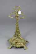 A Victorian-style brass hunting-theme design stick stand, 22” high.