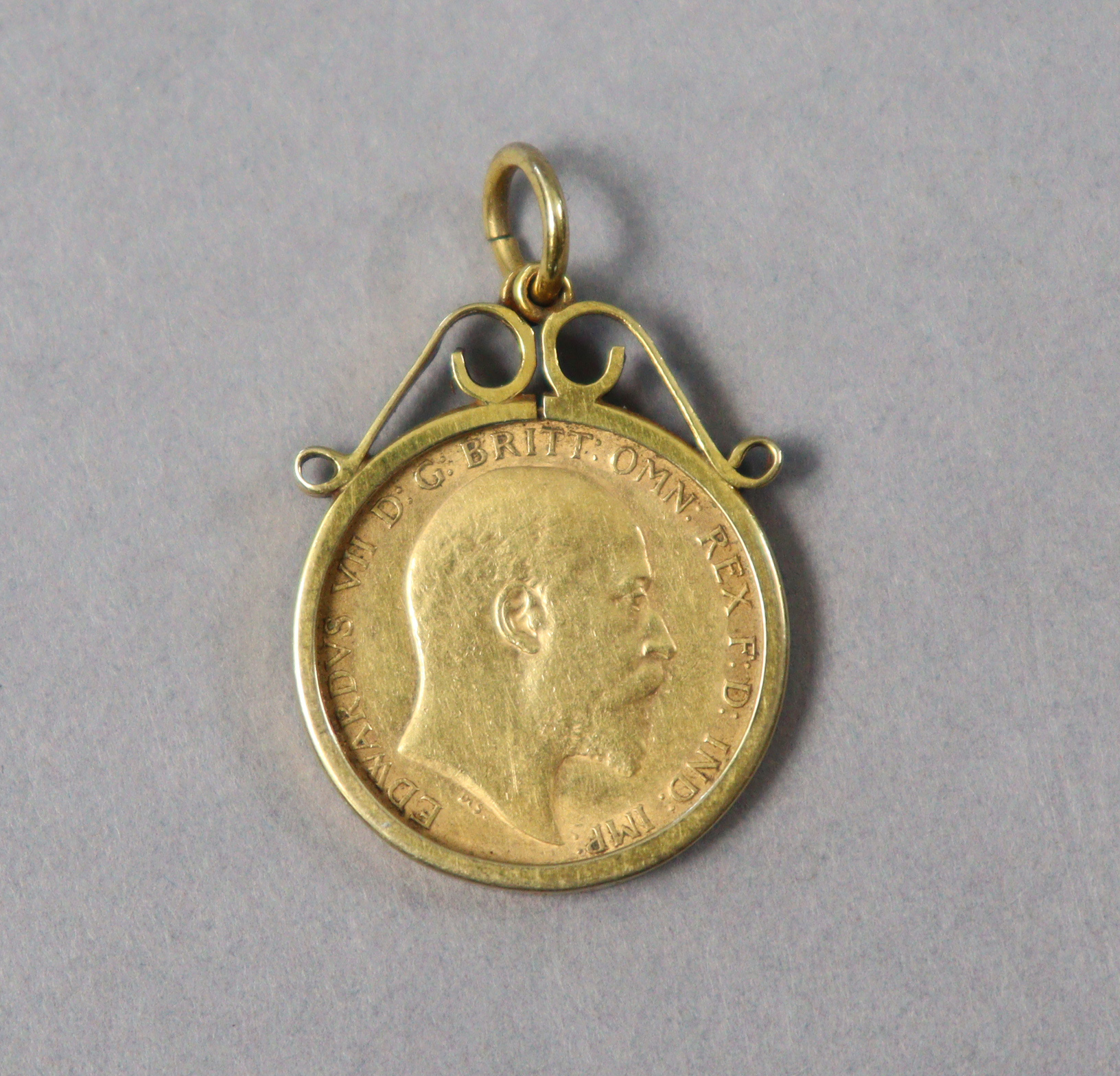 An Edwardian gold half-sovereign, 1910, loose-set in 9ct gold pendant mount. - Image 2 of 2