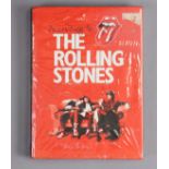A hard-back volume “According to The Rolling Stones”.