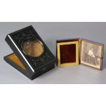 A 19th century carved ebonised wooden stereoscope magnifying box, 8¾” wide; & a daguerreotype female