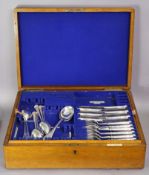 An oak canteen & contents of silver-plated Old English & other flatware & cutlery.