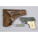 A vintage Webley’s .22 calibre “sports starting pistol” (mark 2), with a leather holster.