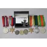 A group of four Second World War medals: 1939-45 Star, Africa Star, Defence & War Medals (un-named);