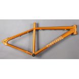 A Kona bicycle frame (orange).