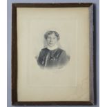 A late 19th/early 20th century photograph of a Boer War nursing sister, 8¾” x 6¾”, framed.