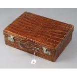 A similar 1920’s crocodile skin small suitcase fitted chrome twin-lever locks (slight faults),