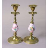 A pair of continental pink-ground porcelain & brass candlesticks on round bases, 8¼” high.