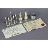 *Withdrawn* A pair of George V silver engraved salt & pepper pots, 3¾” high, Birmingham 1916; a Ge