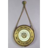A mid-20th century wall barometer in a wooden case, & with Signs of the Zodiac motifs to border,