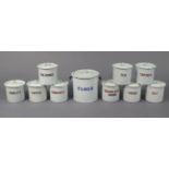 Ten white enamelled kitchen storage jars (various sizes).