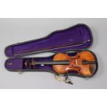 An American(?) violin, circa 1930s, 23¾” long, with bow, & in a fibre-covered case.