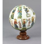 A 19TH CENTURY DECALCOMANIA GLOBE, decorated with numerous figures, animals, etc. & on a turned