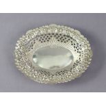 An Edwardian silver oval sweetmeat dish with embossed scroll border & pierced sides, 5¼” x 4¼”,