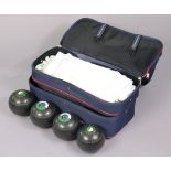 A set of Henselite lawn bowls with a case.