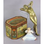 A ceramic novelty risqué female pin tray, 4½” high; a bronzed female nude figure, 12¾” long; & a