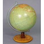 A 1980s Räth (German) “Political Globe”, 12” diameter, on a wooden base, 18¾” high.