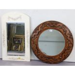 *LOT WITHDRAWN* A circular carved oak wall mirror inset with a bevelled plate, 24” diameter, & a rec