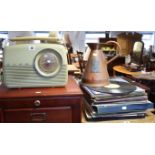 A Bush portable radio; various LP records; & a copper measure.