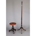 A 19th century mahogany piano stool on a fluted & turned centre column & three carved cabriole legs,