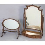 A continental-style tall mahogany rectangular swing toilet mirror fitted three small drawers to