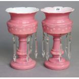 A pair of pink & white tinted glass table lustres each hung with glass prism drops, 10¾” high.