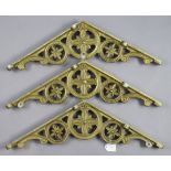 A set of three gold painted aluminium corner brackets of pierced geometric design, 26” wide.