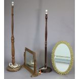 An oval wall mirror inset bevelled plate, in an ornate gilt frame, 19½” x 29½”; together with a