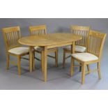 A maple-finish extending dining table with D-shaped ends, centre leaf, & on four square tapered
