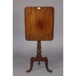 A 19th century mahogany tripod table with rounded corners to the rectangular tilt-top, & on a vase-