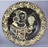 LIZ BOYLE (20th century) A slip-decorated earthenware charger in the 17th century style, depicting a