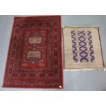 A Persian pattern rug of blue & ivory ground & with repeating multi-coloured geometric design to