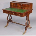 A reproduction mahogany ladies writing desk fitted six small drawers & a small pair of cupboards