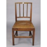 An early 20th century cottage dining chair with a hard seat, & on square tapered legs with plain