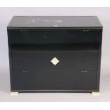 A late 20th century French black-finish dwarf cabinet having a smoked-glass top, & fitted three long