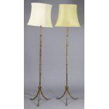 A pair of late 20th century gilt brass faux bamboo standard lamps, each on three splay feet, with