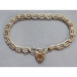 A 9ct. gold gate-link bracelet with padlock clasp. (w.a.f., 8.1 gm).