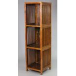 A late 19th/early 20th century Chinese elm three-tier display stand, with pierced decorative side