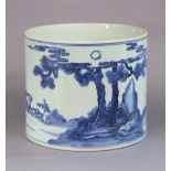A Chinese blue & white porcelain brush pot decorated with a continuous river landscape with