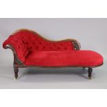 A Victorian mahogany frame chaise lounge with buttoned back & sprung seat upholstered crimson