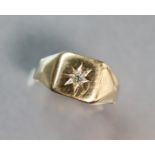 An un-marked yellow metal ring with gypsy-set small diamonds; size: P; 4.3 gm.