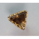 A yellow 14K ring set large triangular-cut smokey quartz; size: P 12.2 gm.