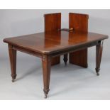 A Victorian mahogany extending dining table with moulded edge & canted corners to the rectangular