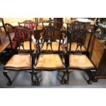 A set of six mahogany Chippendale-style dining chairs (including a pair of elbow chairs) with carved