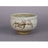 TAKESHI YASUDA (b. 1943) A stoneware footed bowl with speckled mushroom glaze & painted foliate